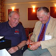 John Ridgeway receiving a gift from Adam Miller